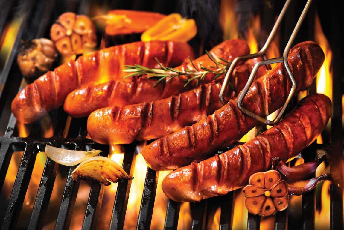 iBeef sausages grilling on the fire